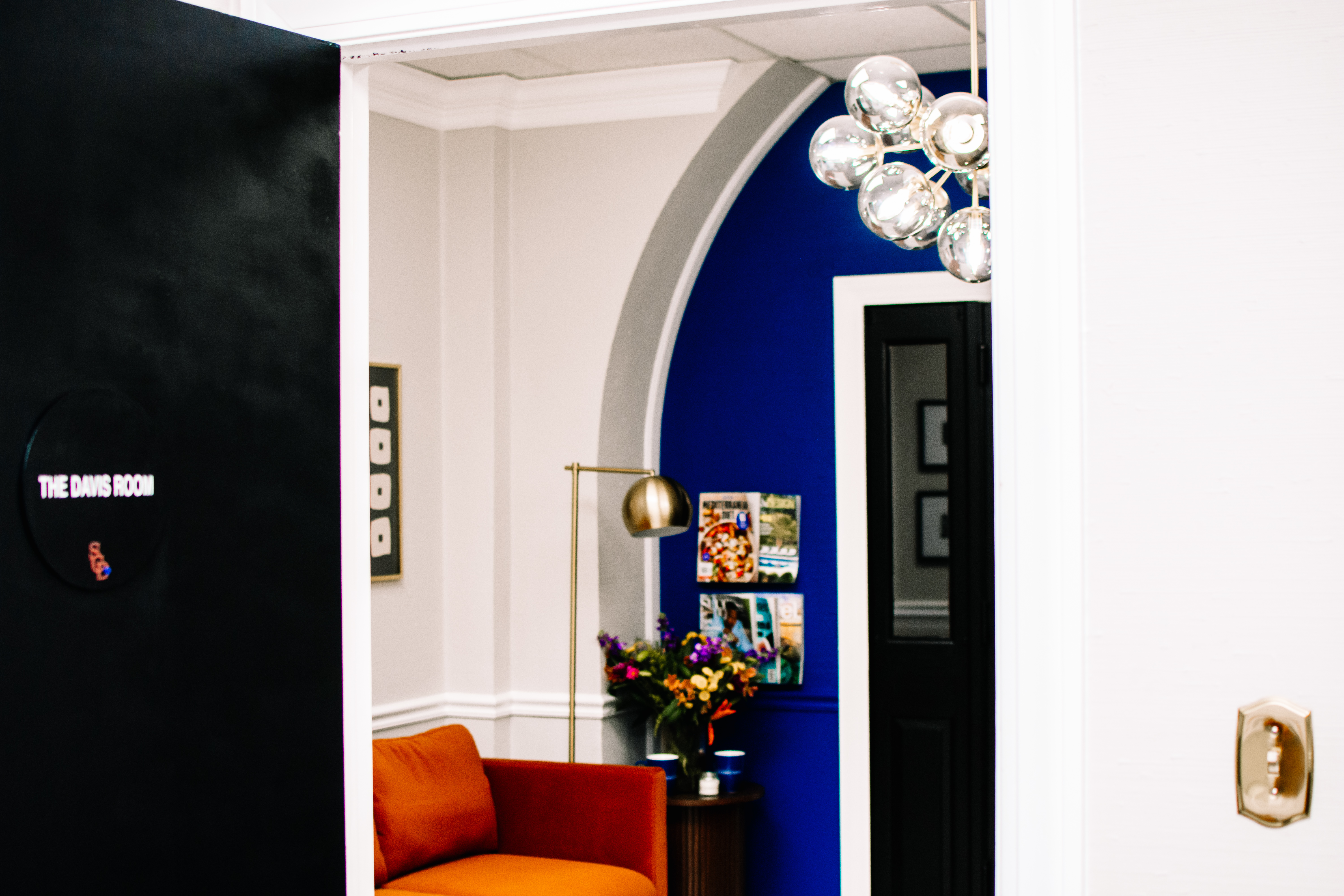 Davis Room door detail with peekthrough to reception