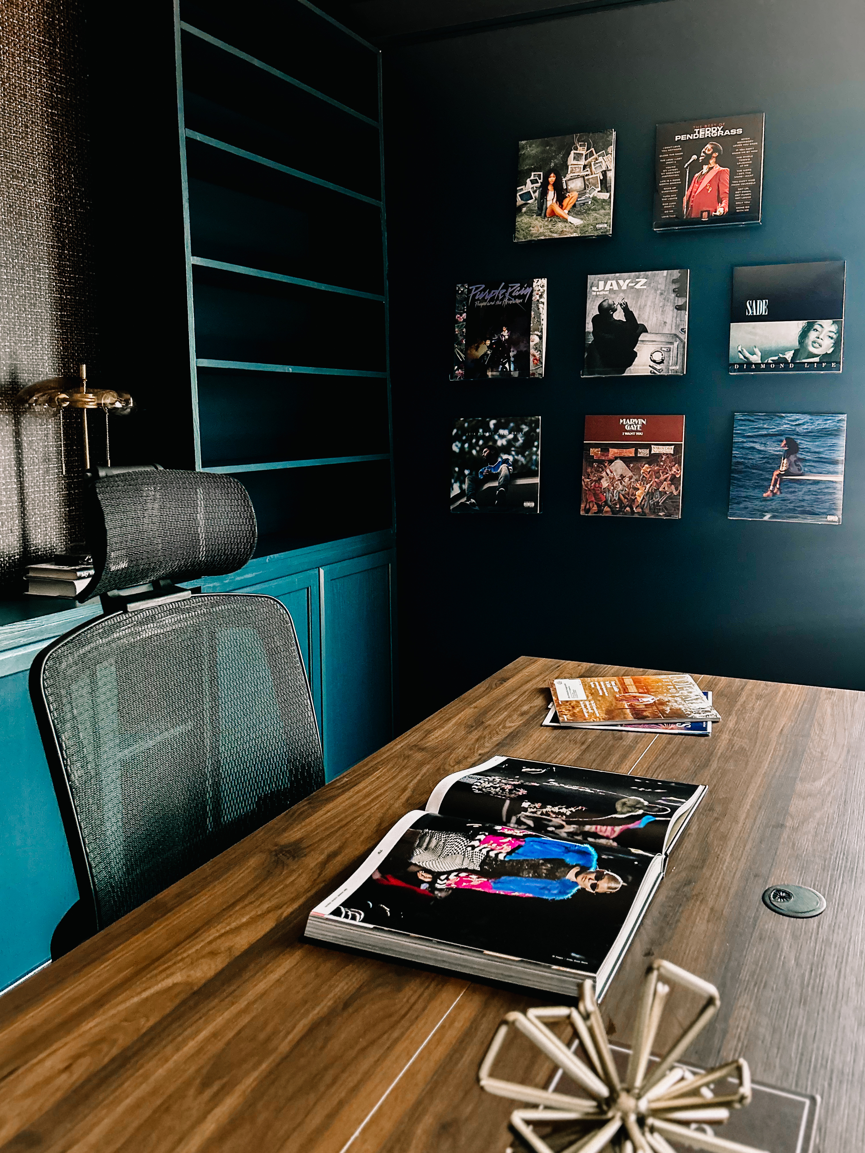 Desk with record wall and open magazine