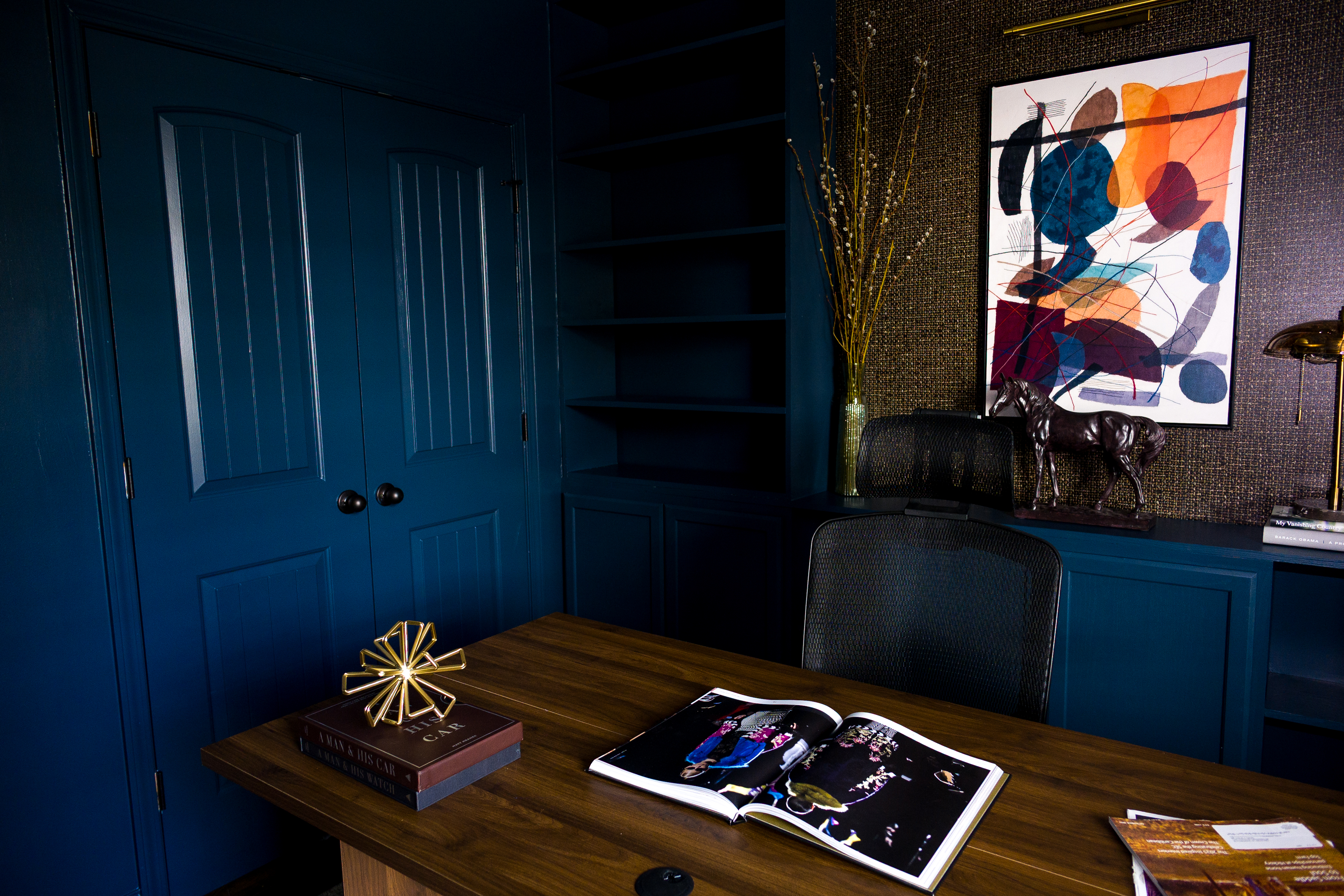 Desk view looking toward grasscloth wall and sculpture