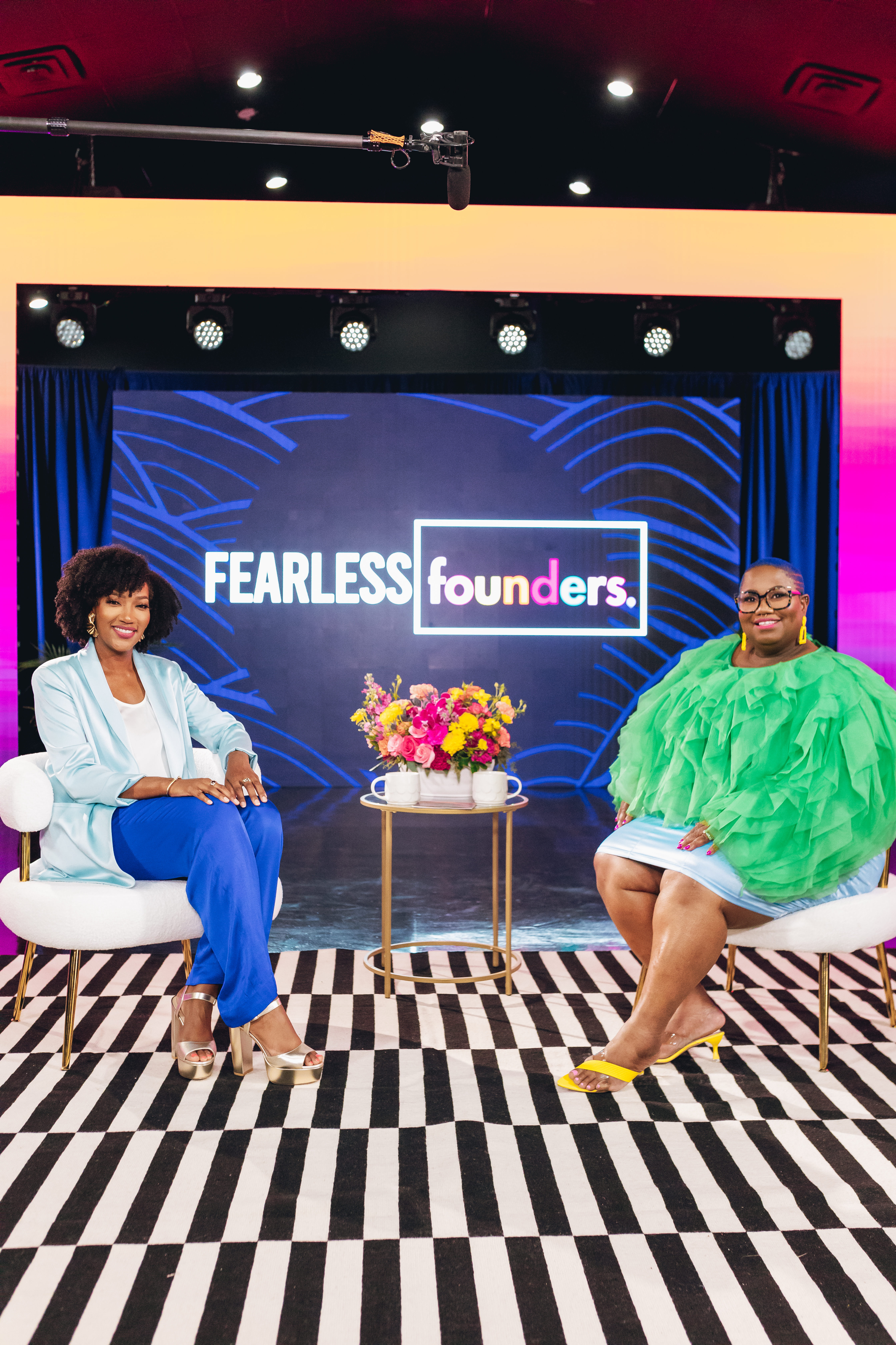 Fearless Founders hosts on set with full branding