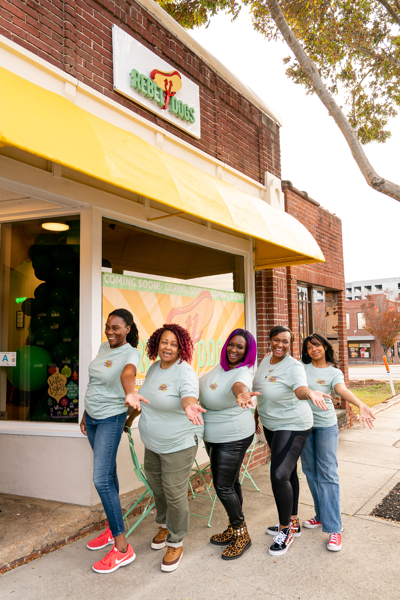 Rebel Dogs grand opening — sunburst mural and brand environment